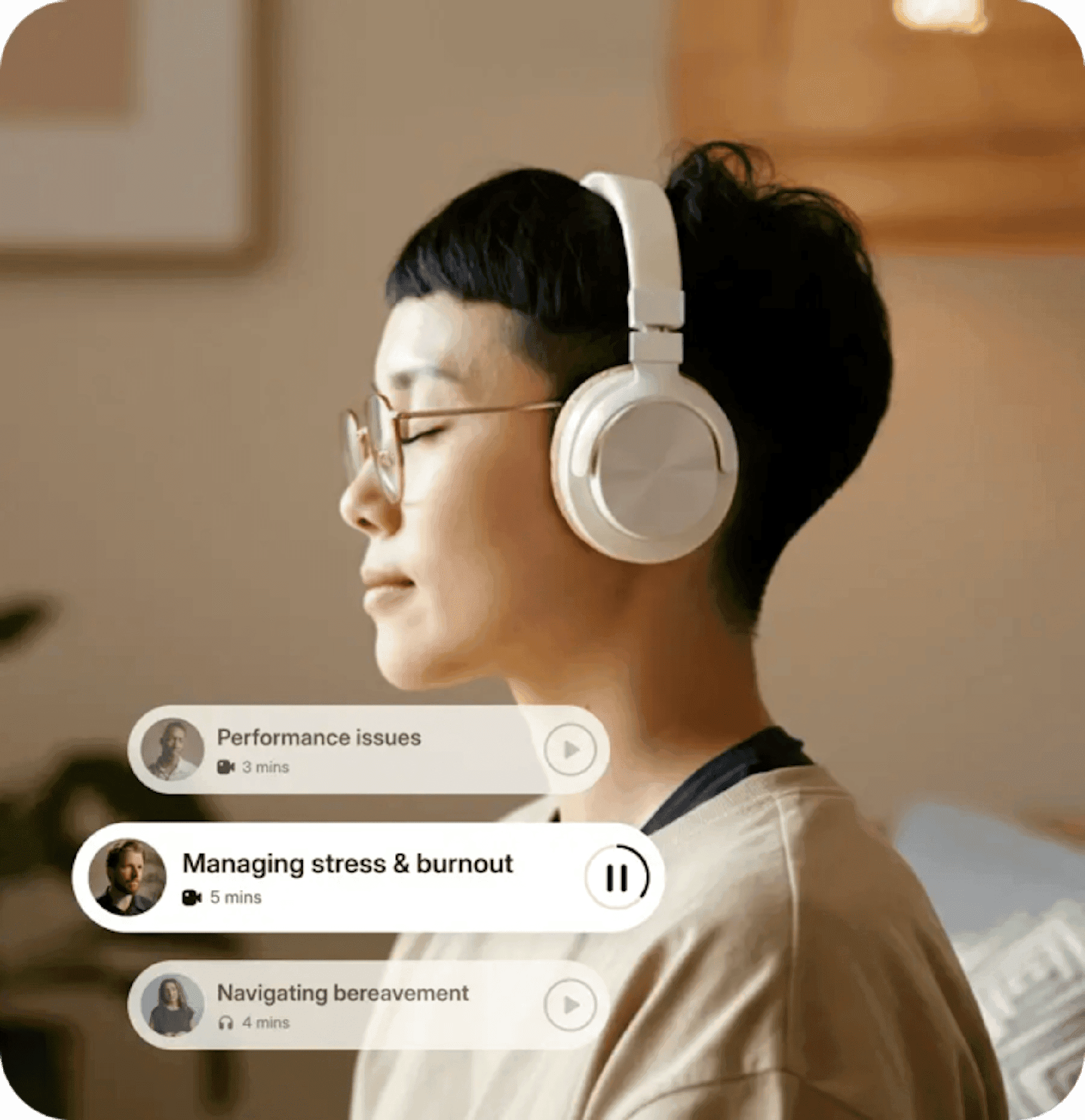 A person with headphones listening to guided audio in a quiet bedroom