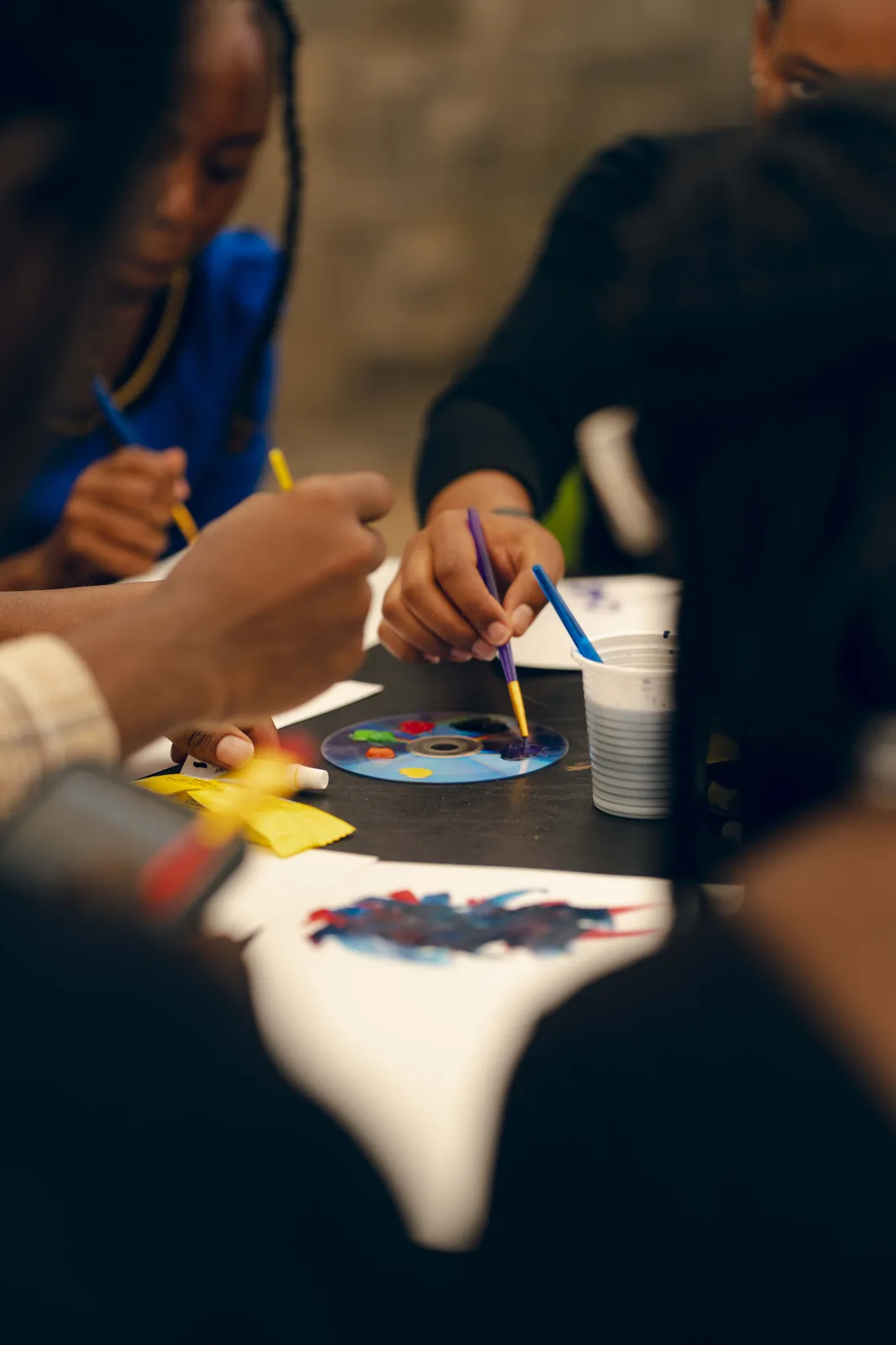 A young person painting at a Heyrafiki art therapy session in Nairobi